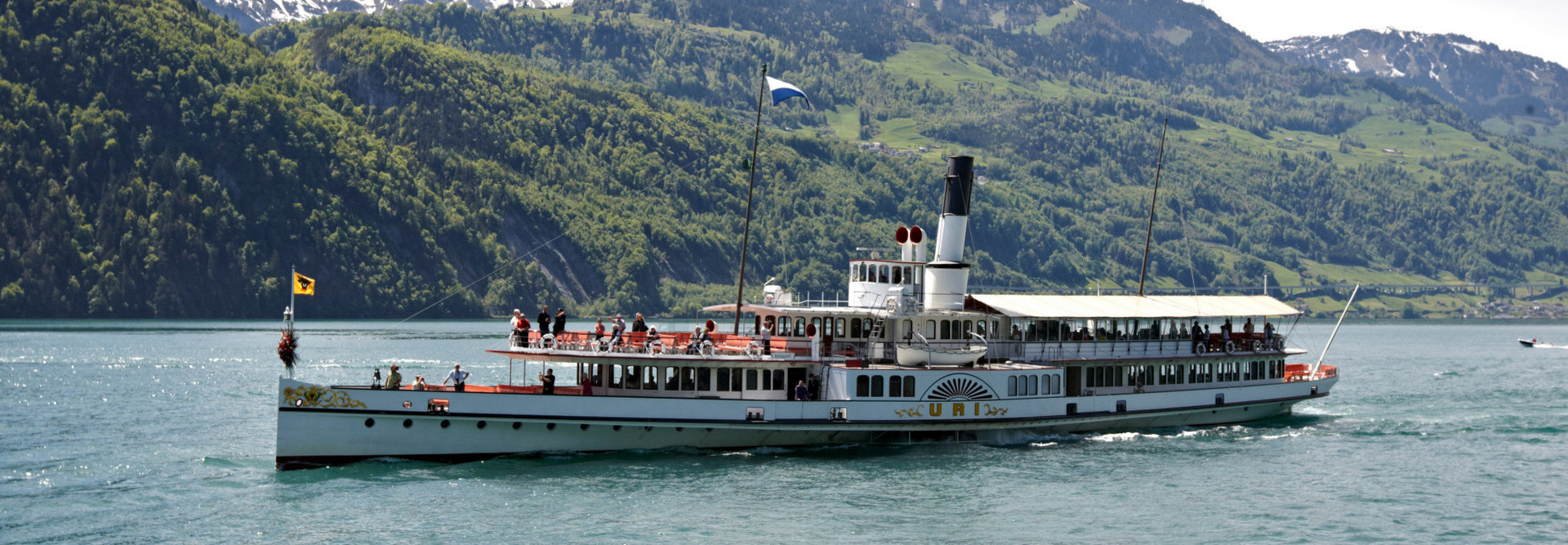 Steamboat Uri in front of the Seelisberg during a trip on Lake Lucerne. 